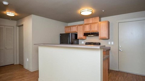 a kitchen with a counter top and a microwave